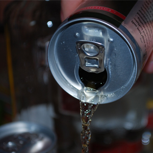 Drink being poured into bar glass